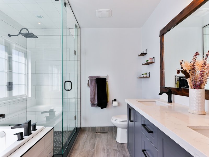 Modern Toronto-area bathroom with glass shower and floor-to-ceiling window